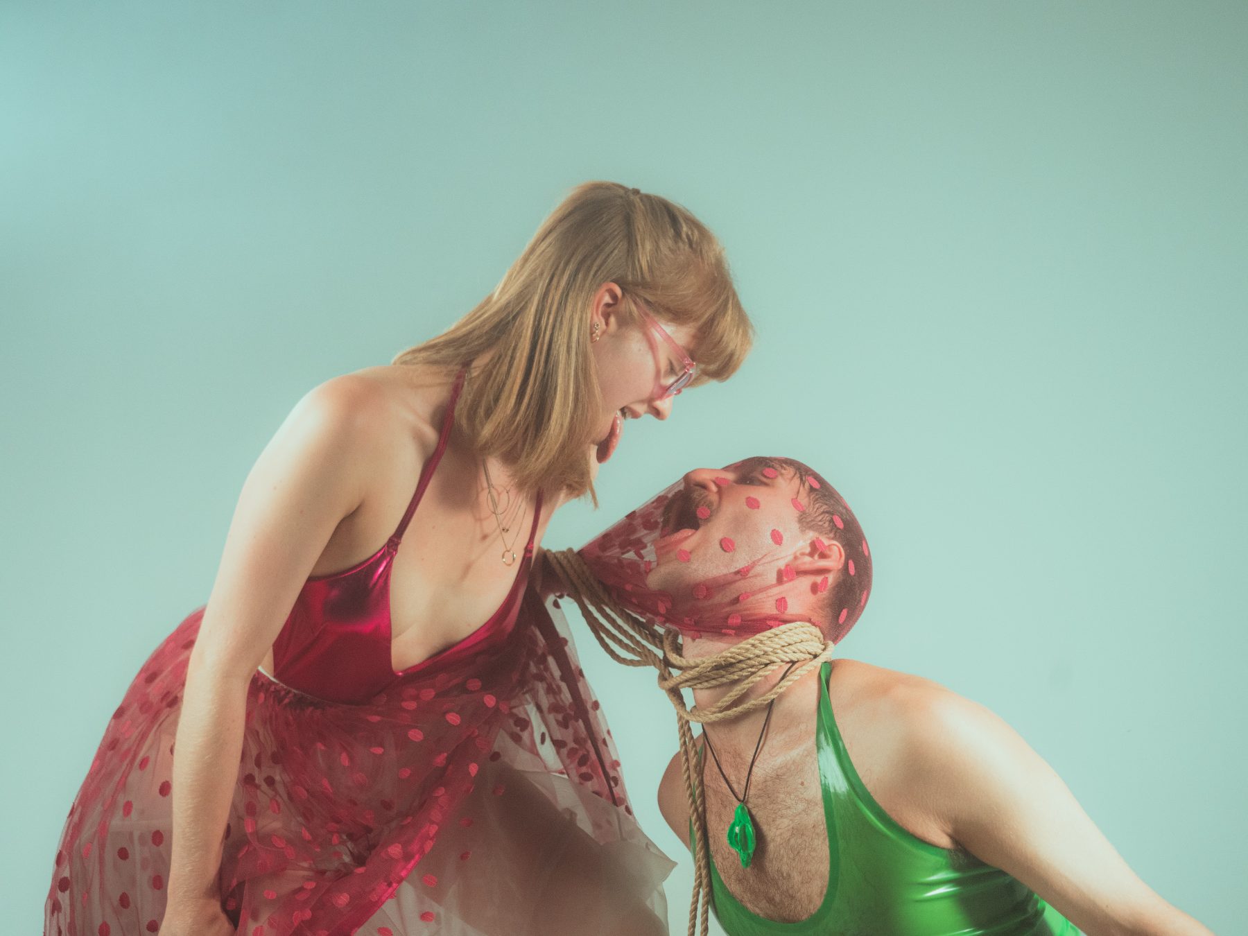 Two figures in red and green